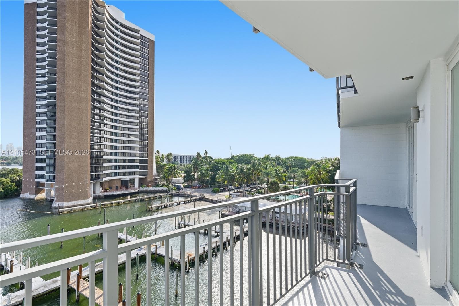 Private balcony with metal railings and water access