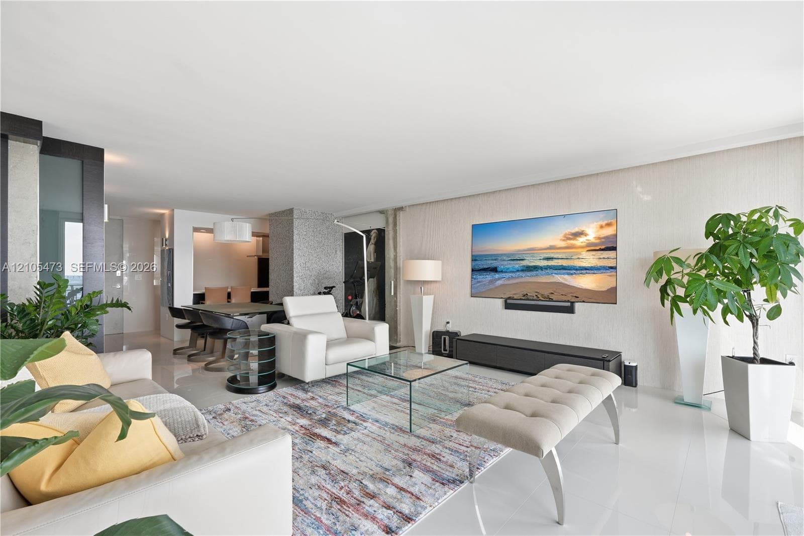 Open-concept living area with polished tile flooring