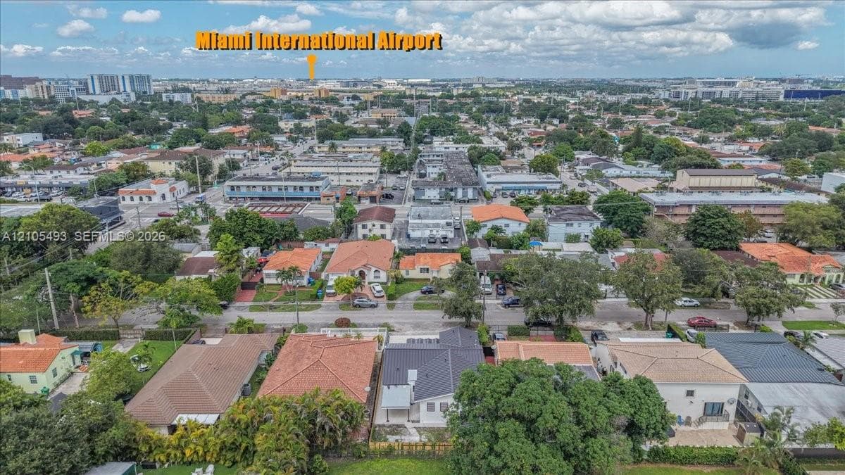 Aerial perspective of an urban neighborhood featuring established tree canopy, grid-patterned streets, and proximity to Miami International Airport