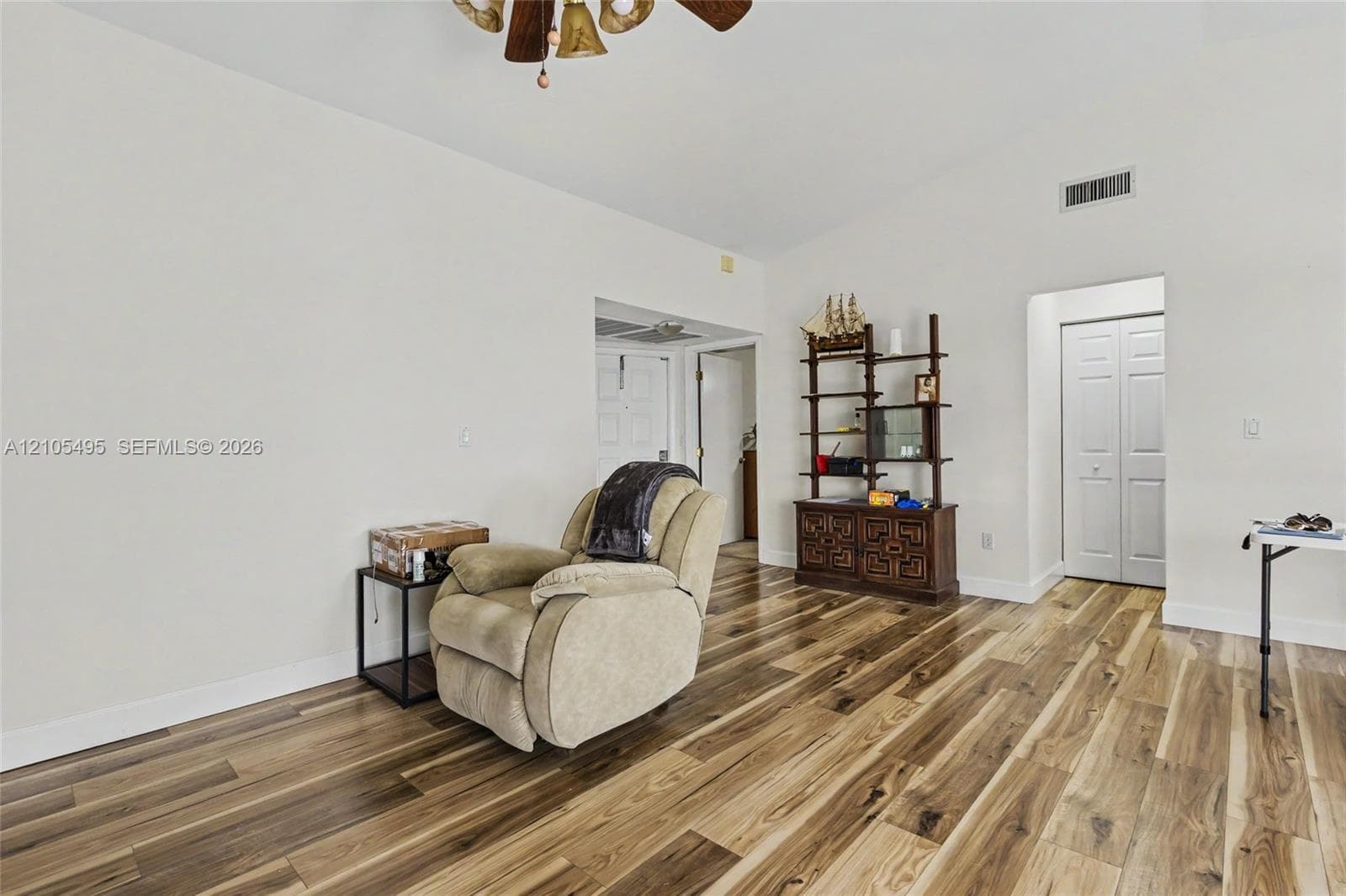 Vaulted ceilings, wood-finish flooring, and multi-panel interior doors