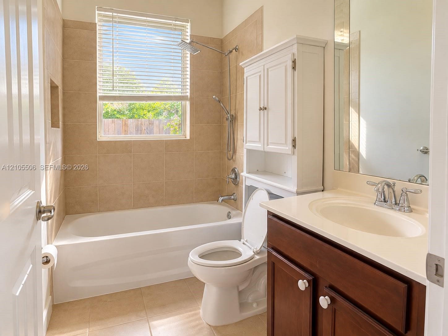 White vanity with an integrated sink and chrome fixtures