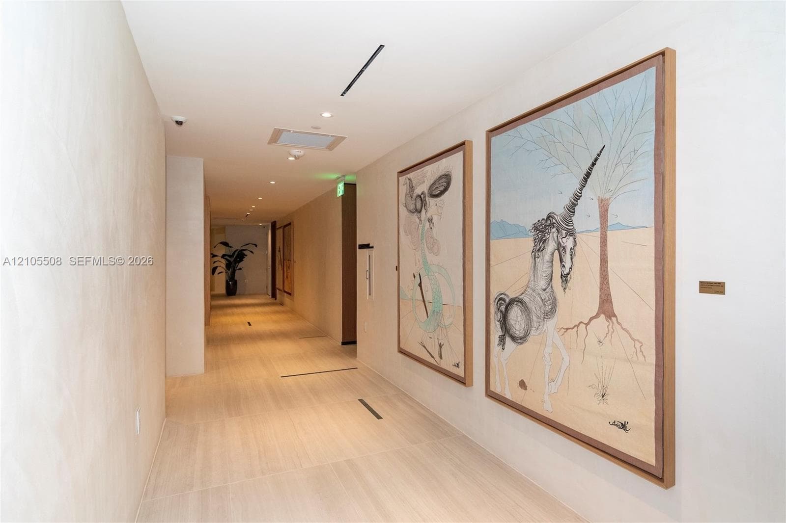 Recessed lighting, wood-finish flooring, and white walls
