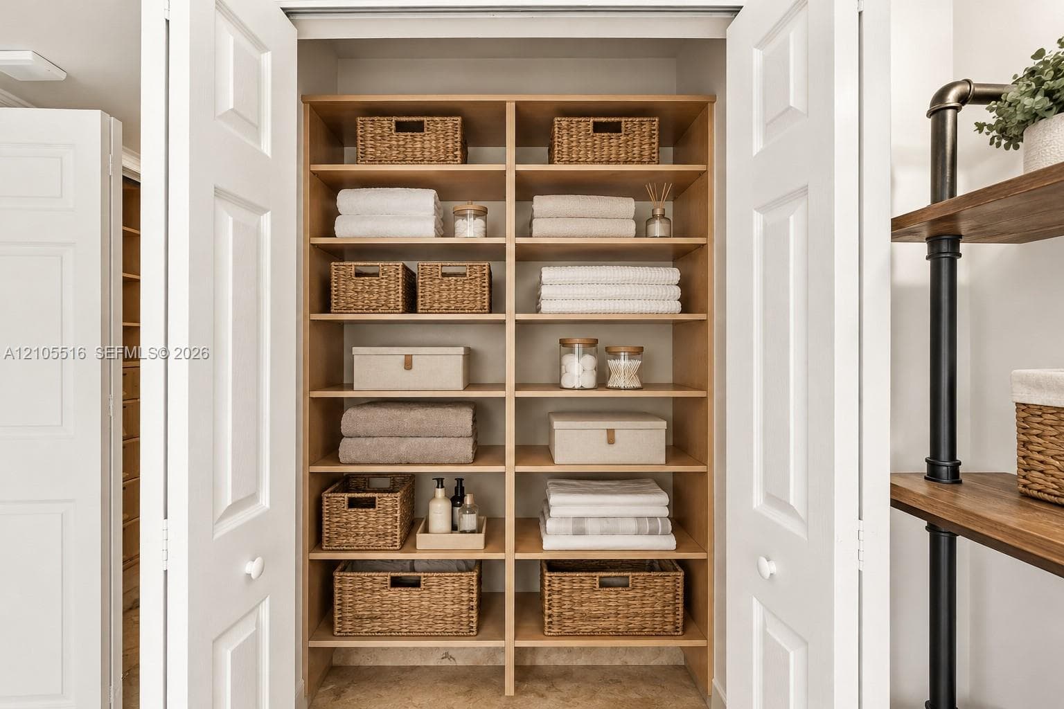 Built-in closet shelving with light wood-finish