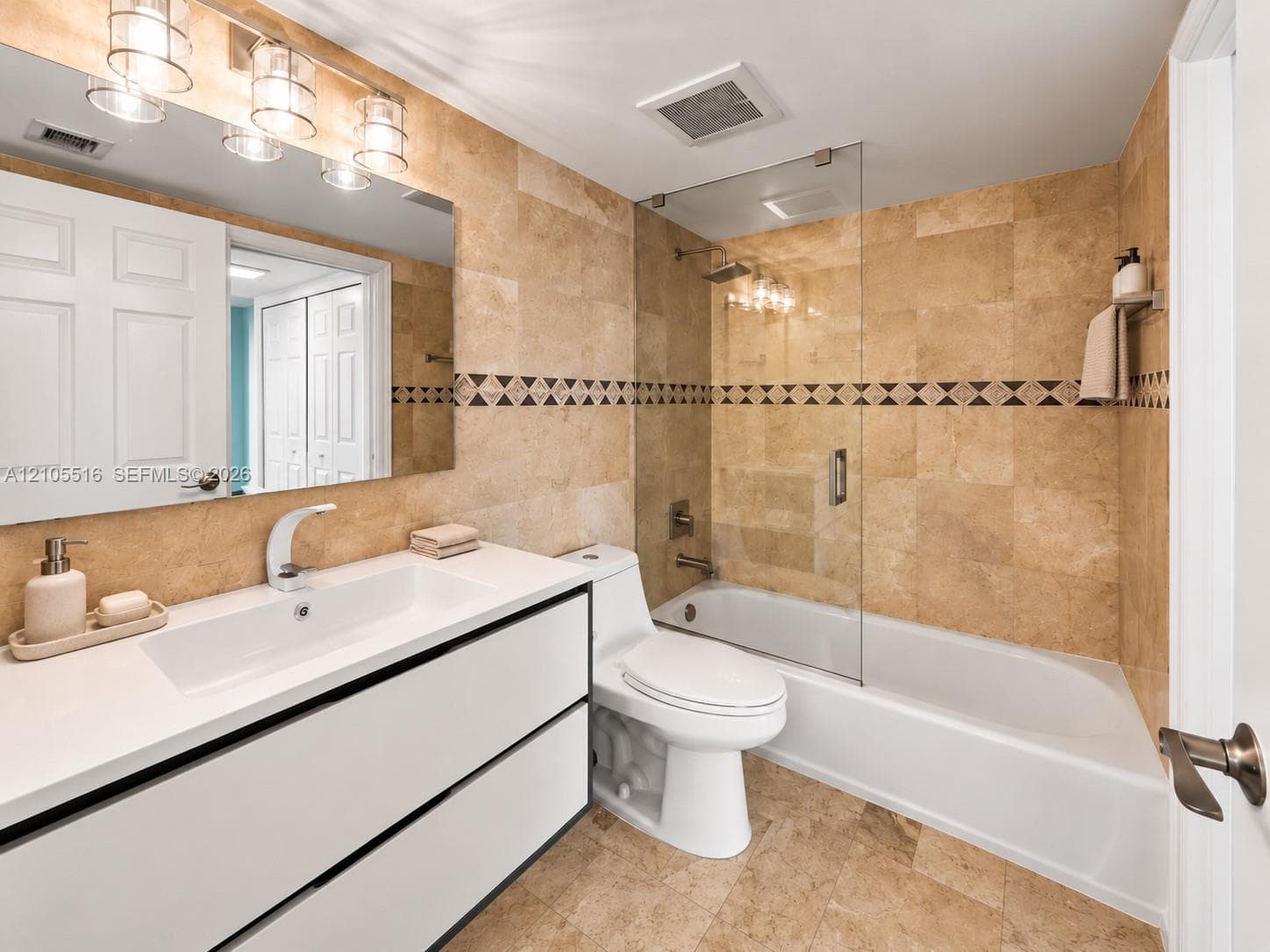 Light-toned tiled flooring and walls