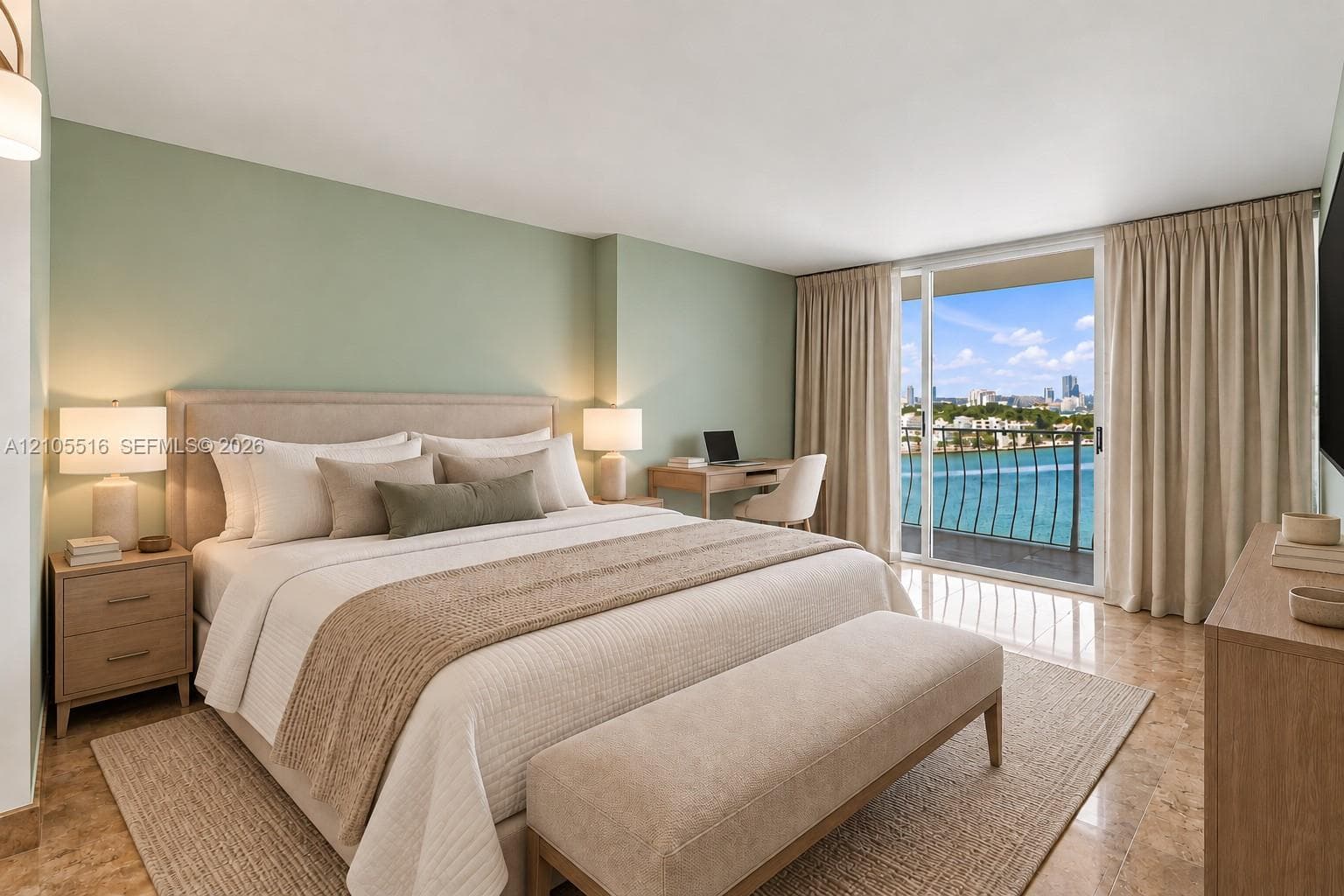 Sliding glass doors opening to a balcony with water scenery, light-toned walls, recessed lighting, and wood-finish flooring