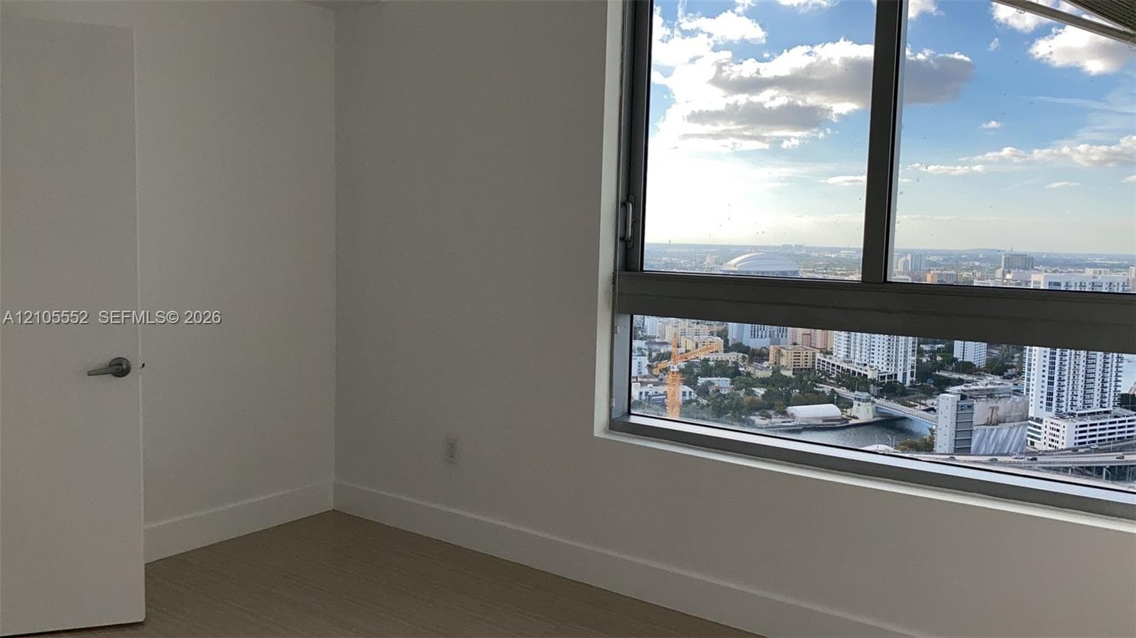 Expansive window with city and waterway scenery