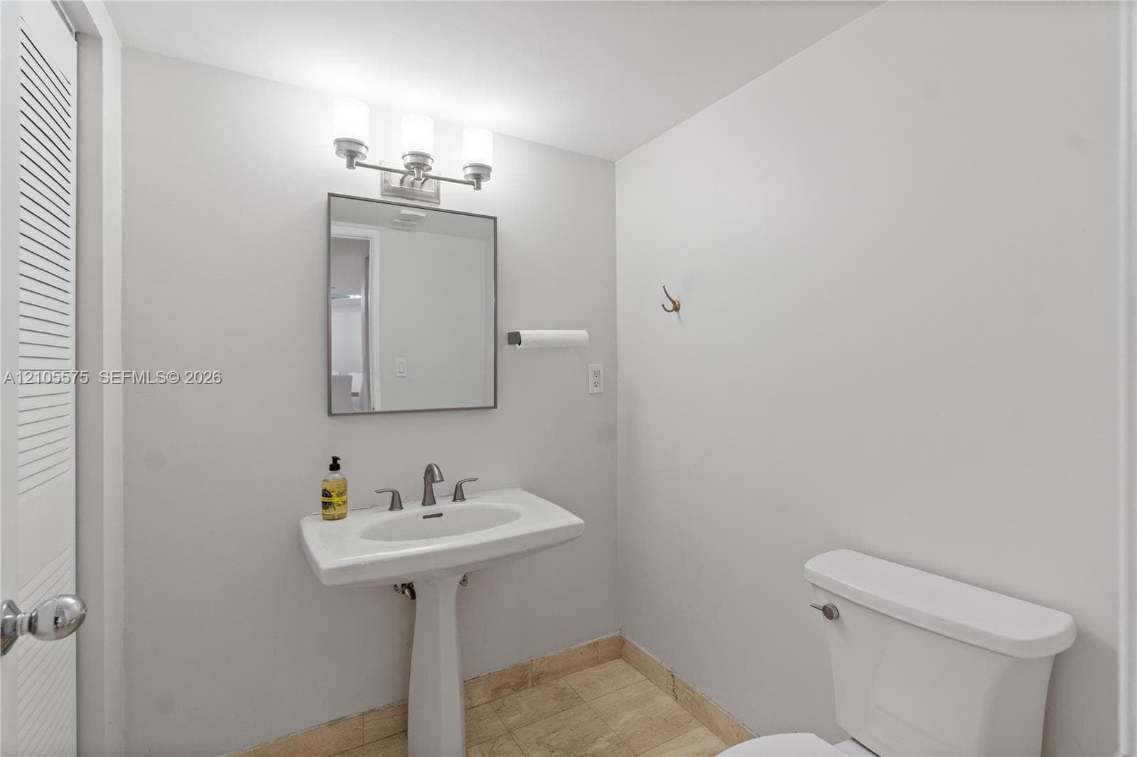 Convenient guest powder room and in-unit washer and dryer, providing everyday comfort and functionality at Mystic Pointe in Aventura.