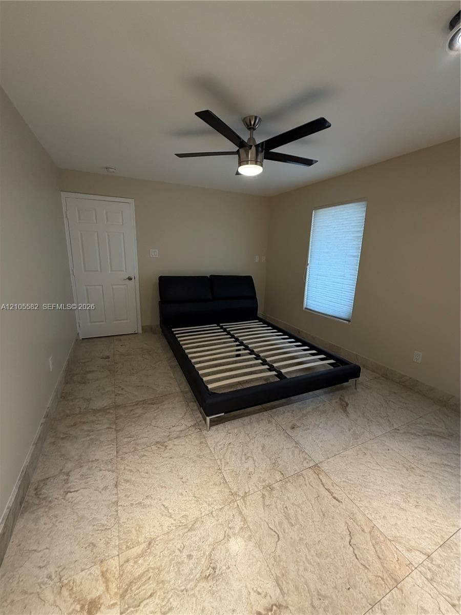 Recessed lighting, ceiling fan with integrated lighting, tiled flooring, window with blinds