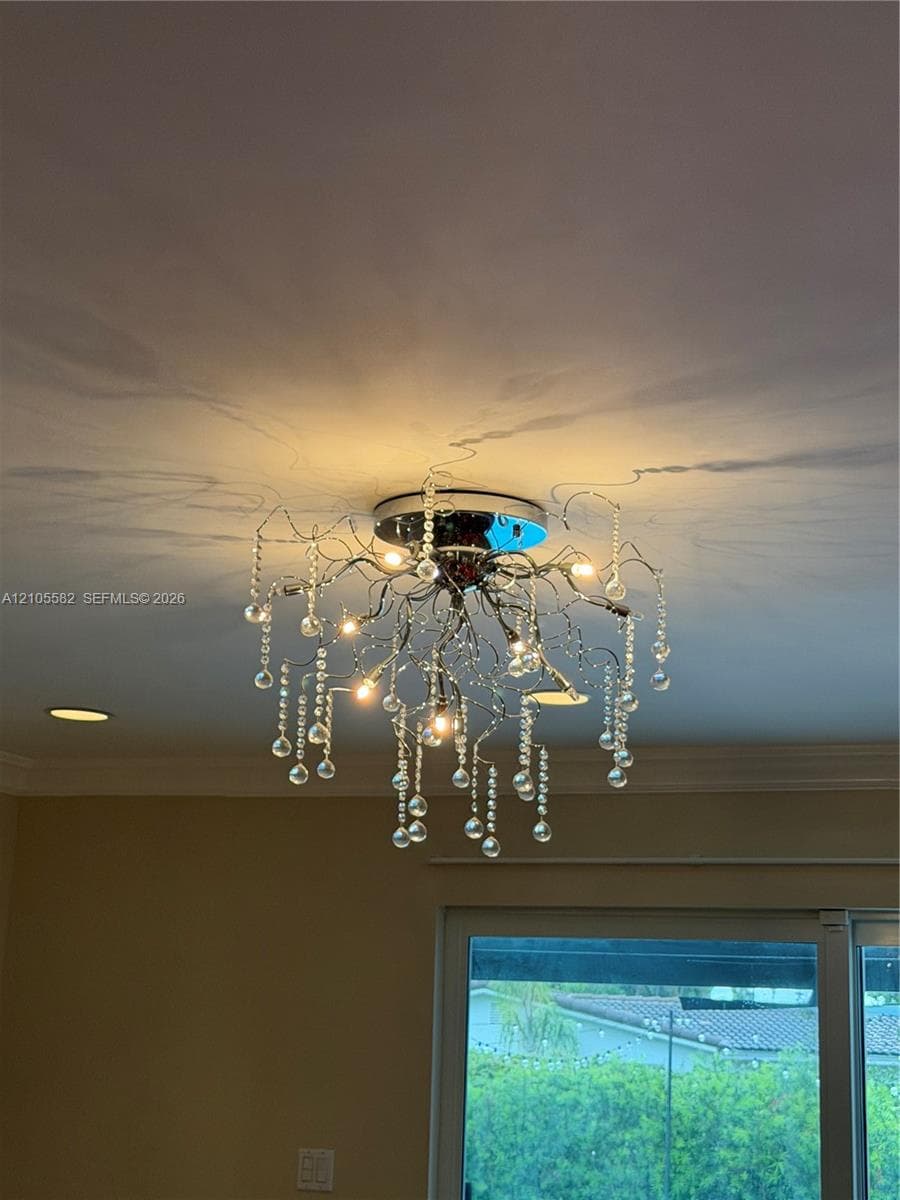 Decorative ceiling-mounted light fixture with crystal details