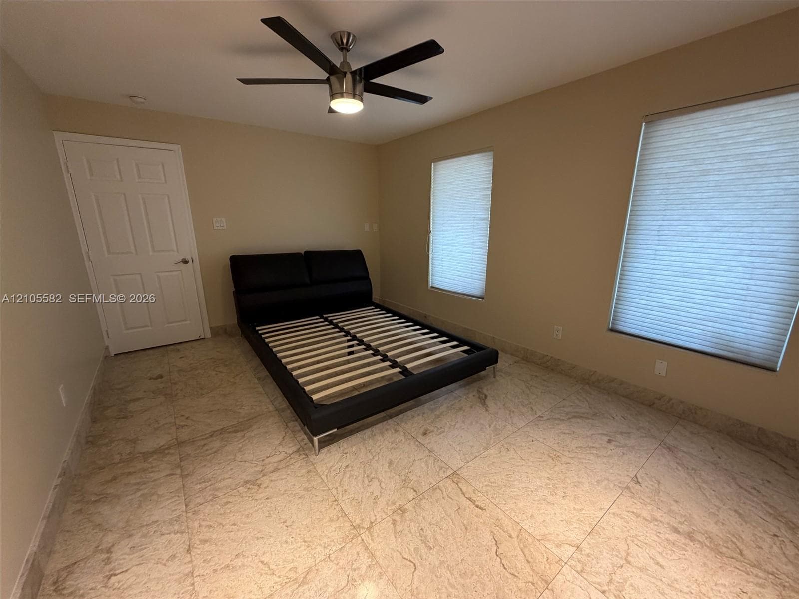 Neutral-toned walls complement the tile flooring