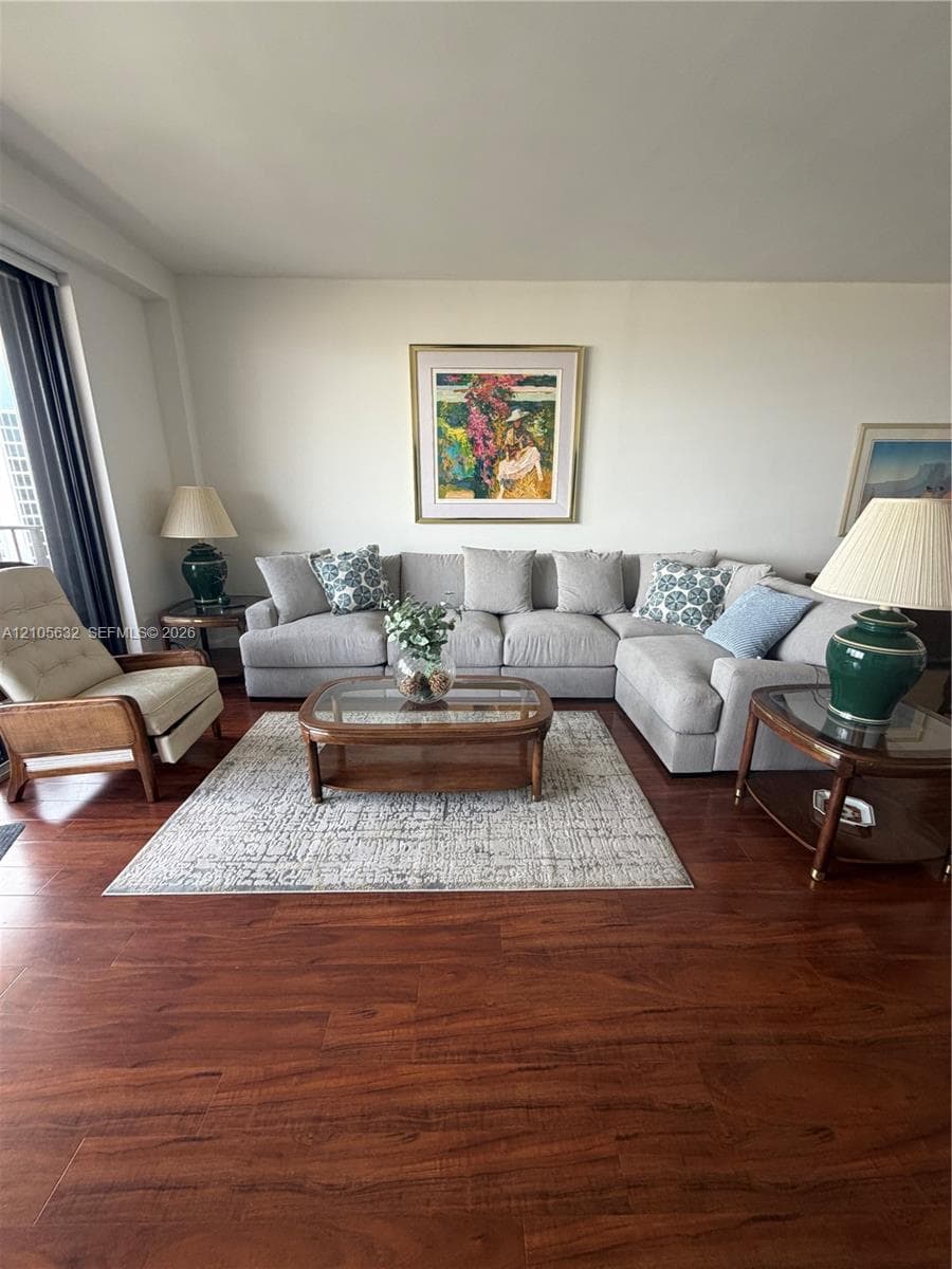 Wood-finish flooring throughout and floor-to-ceiling glass
