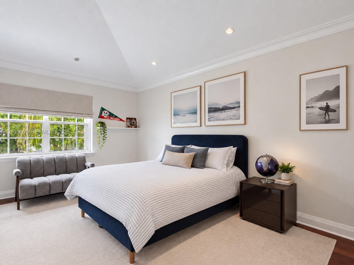 Vaulted ceilings, crown molding, recessed lighting, multi-pane windows, and a built-in floating wall shelf