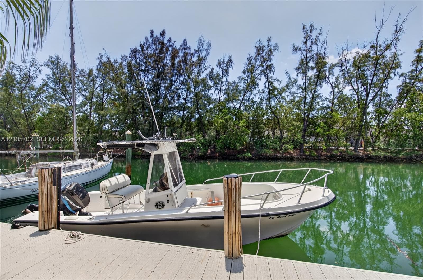 Bulkhead dock featuring wood-finish pilings and direct waterway access