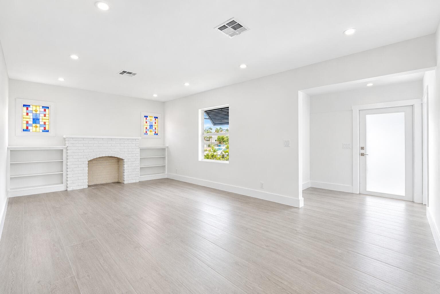 Bright White Living Room with Stained Gl