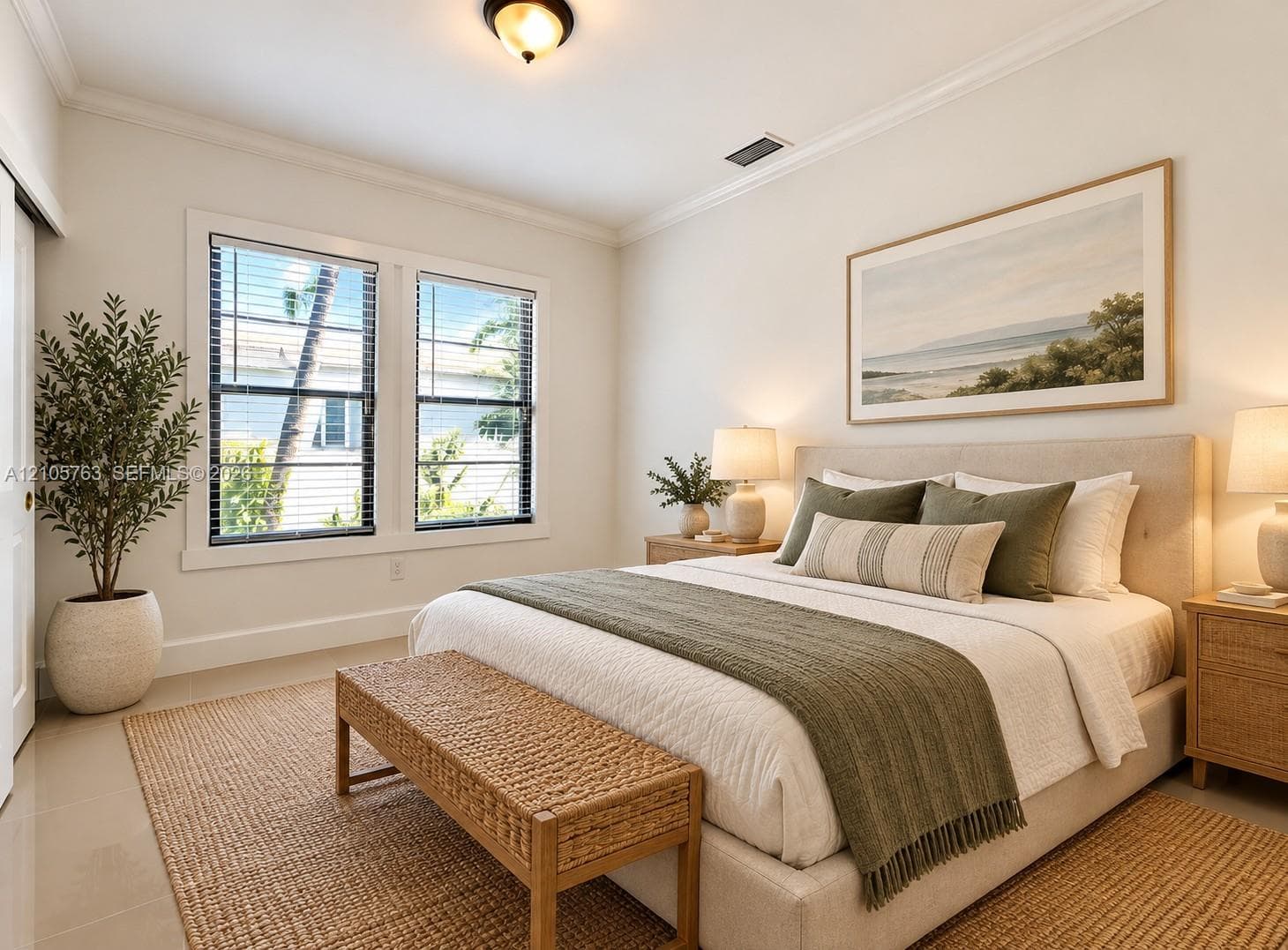 Neutral wall color palette, crown molding, and expansive windows featuring horizontal blinds and sliding door access