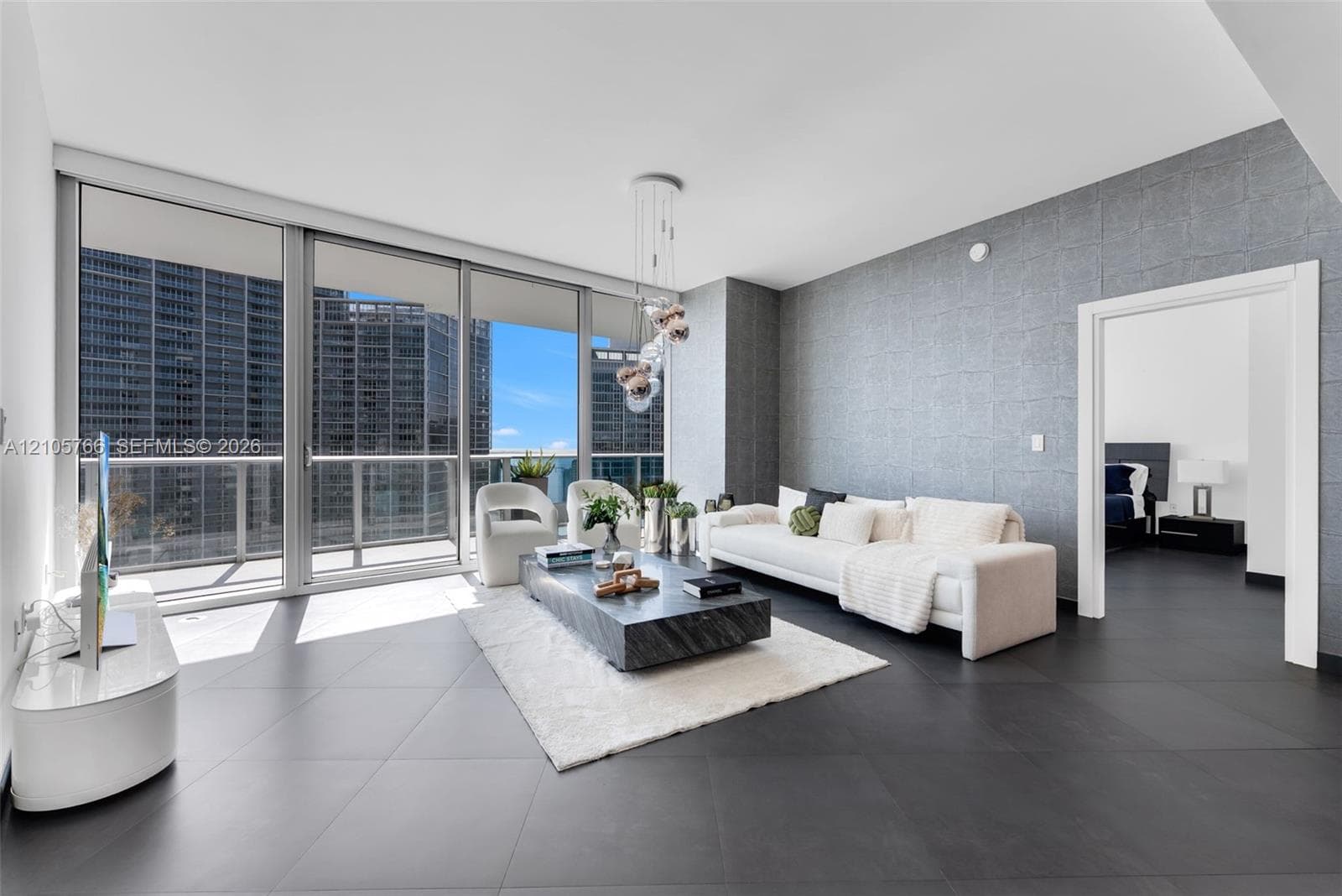 Living room seating beside the sliding glass doors to the terrace.