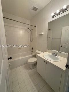 Bathroom featuring a vanity with integrated sink and countertop, a large wall-mounted mirror, a tiled shower-tub combination, and three-light overhead fixture