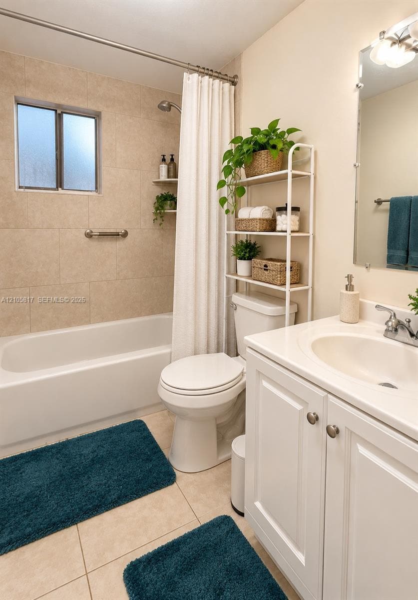 White vanity cabinet with an integrated basin, tub and shower combination featuring neutral-toned tile surround, built-in wall niches, and a polished chrome wall-mounted light fixture above the vanity mirror