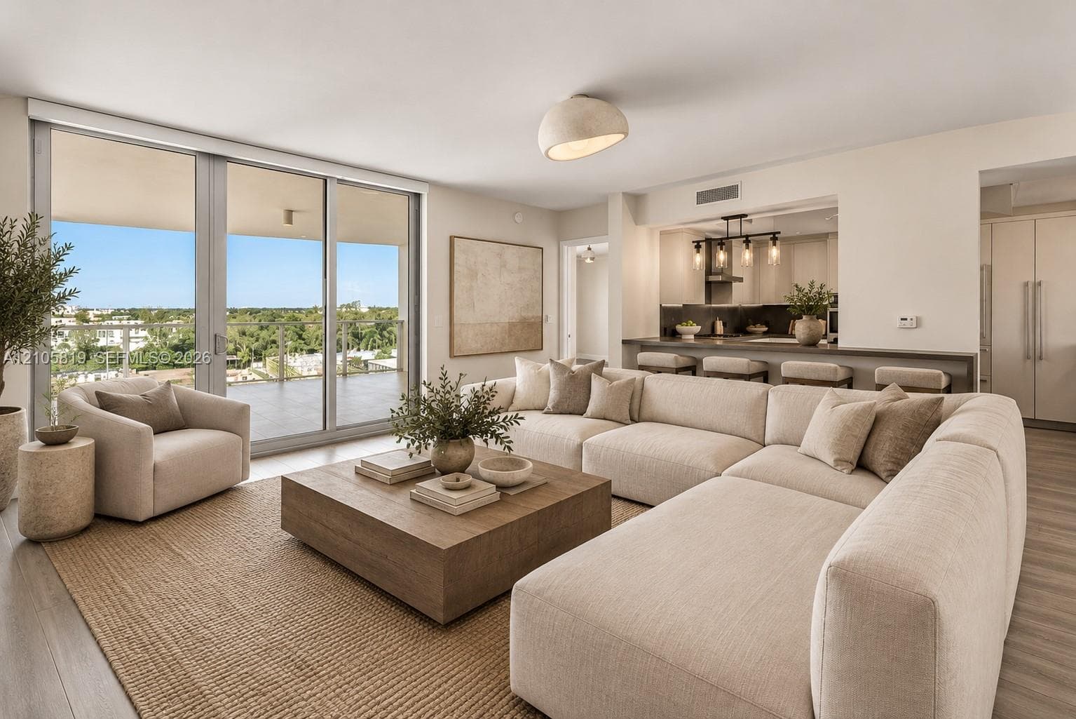 2nd Living Room, right off the Kitchen, with access to the Western Terrace with BBQ.