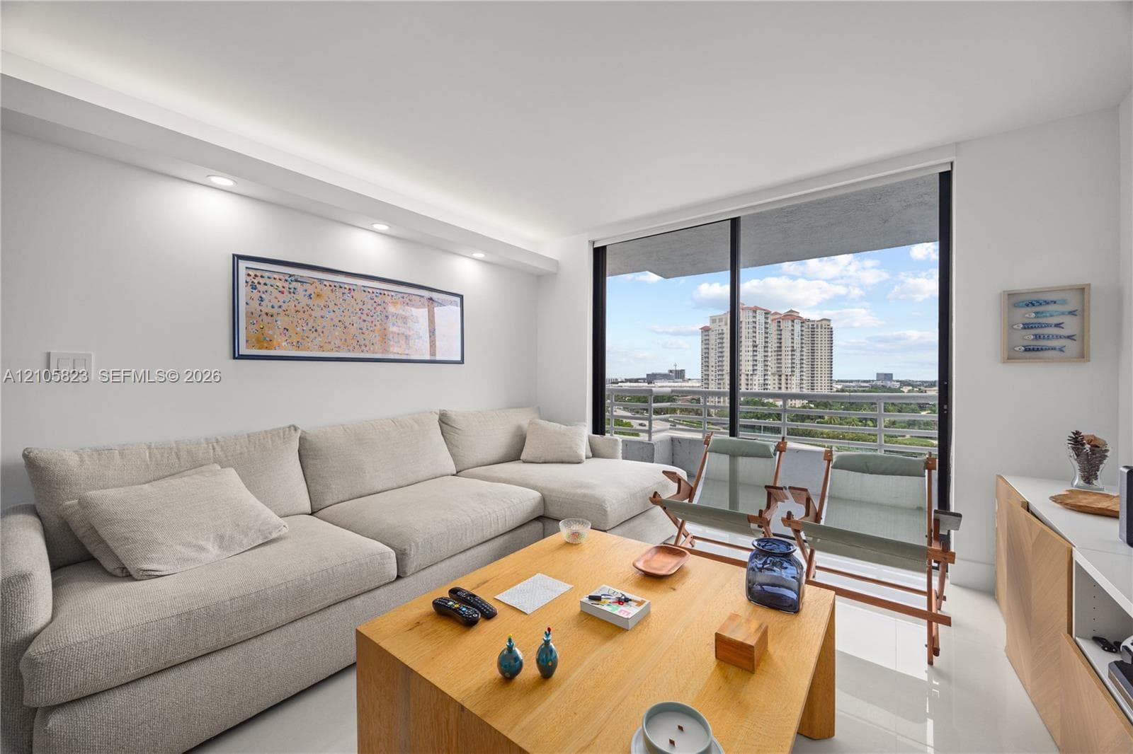 Floor-to-ceiling sliding glass doors, recessed lighting, soffit accent ceiling, and tile flooring