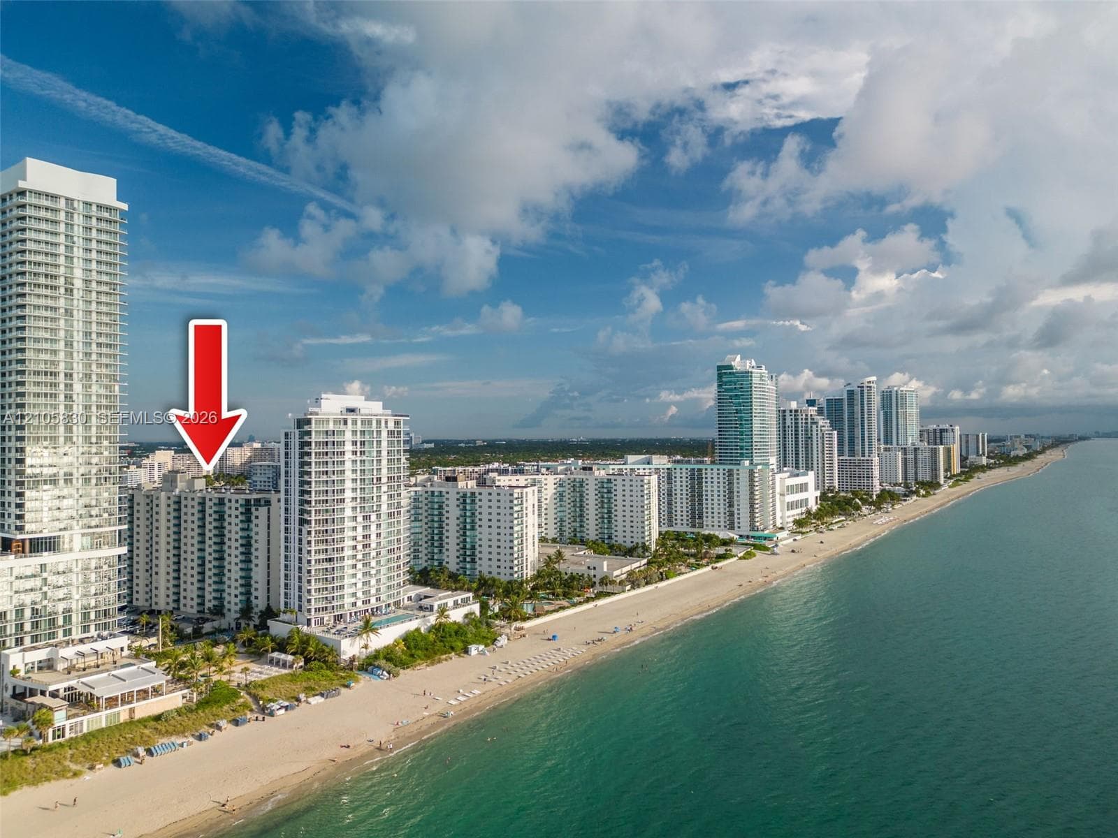 High-rise residential building featuring a glass and concrete facade located on the Atlantic coastline