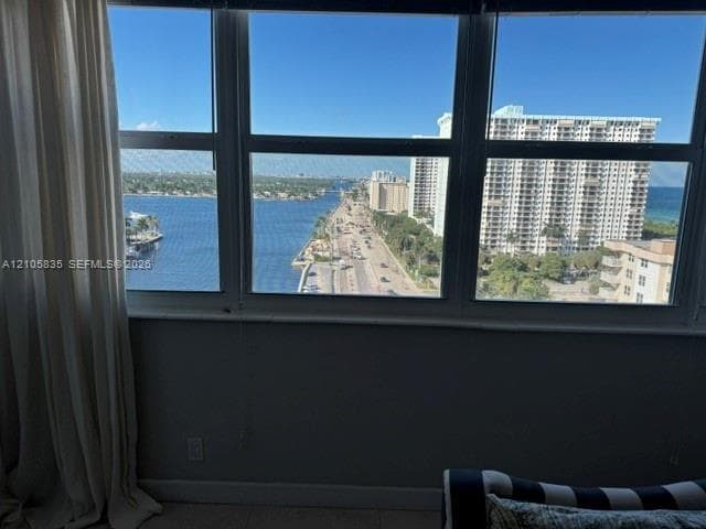 Large-pane multi-section windows featuring expansive water and coastal scenery