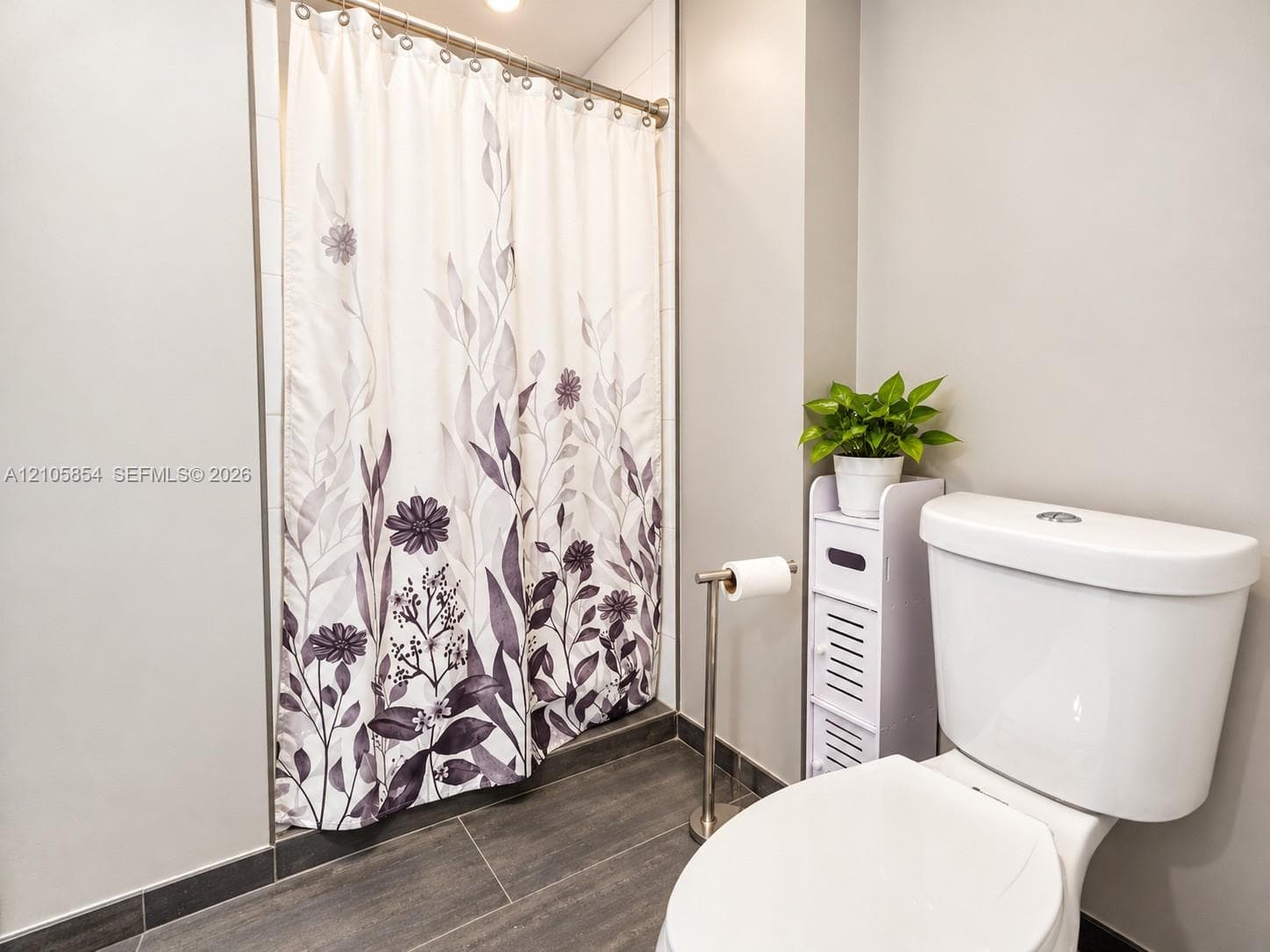 A first floor full bathroom next to a bedroom provide flexibility for guests, family, or a home office