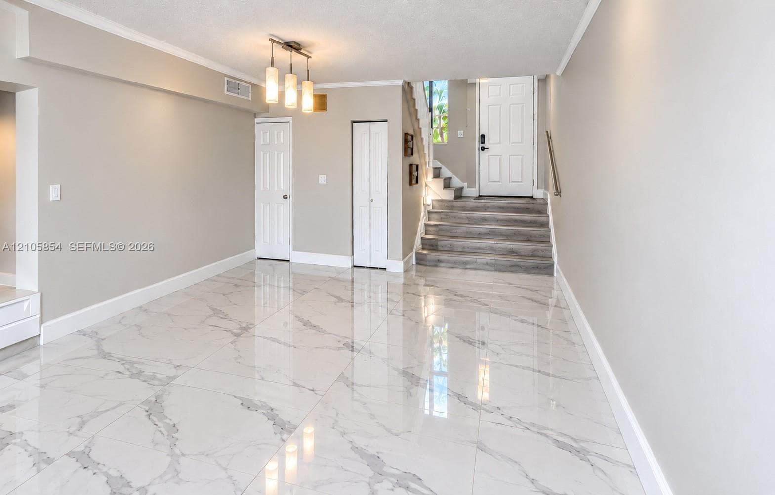Edited image showing how the room would look without furniture, highlighting its spacious layout and beautiful flooring