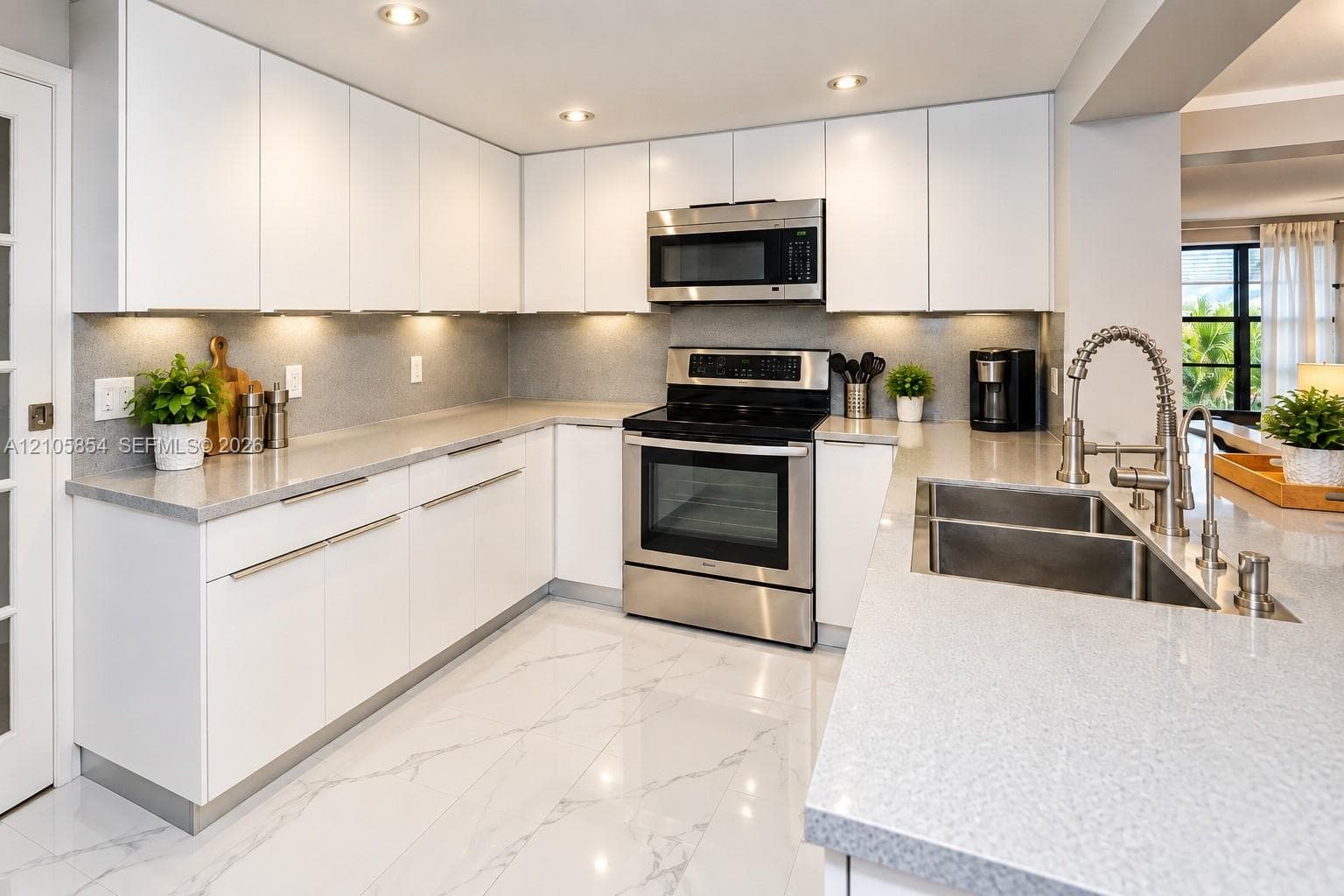 Kitchen features a spacious, deep stainless steel sink for added comfort and convenience.