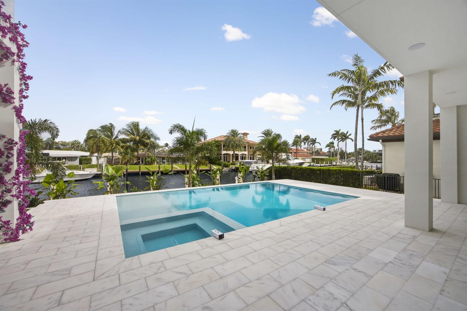 Backyard rear patio look out at pool wat