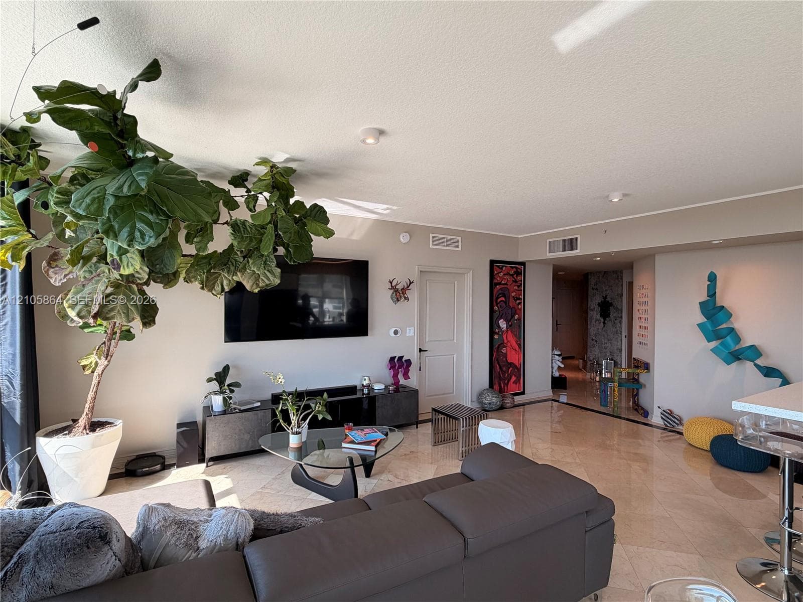 Polished stone flooring throughout with recessed lighting
