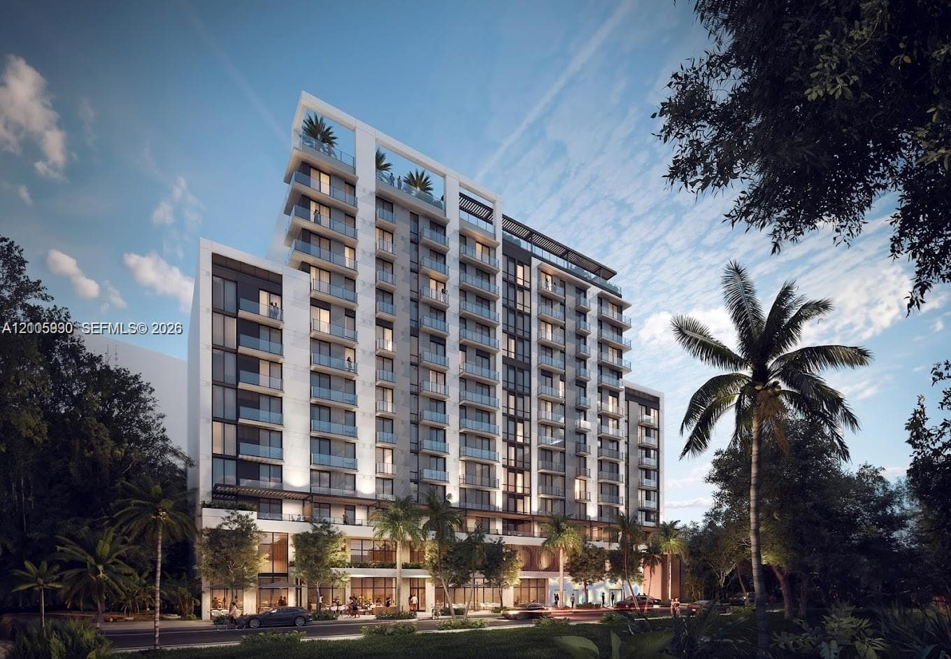 Multi-story modern high-rise featuring a glass and concrete facade, tiered private balconies, floor-to-ceiling windows, and a rooftop terrace level