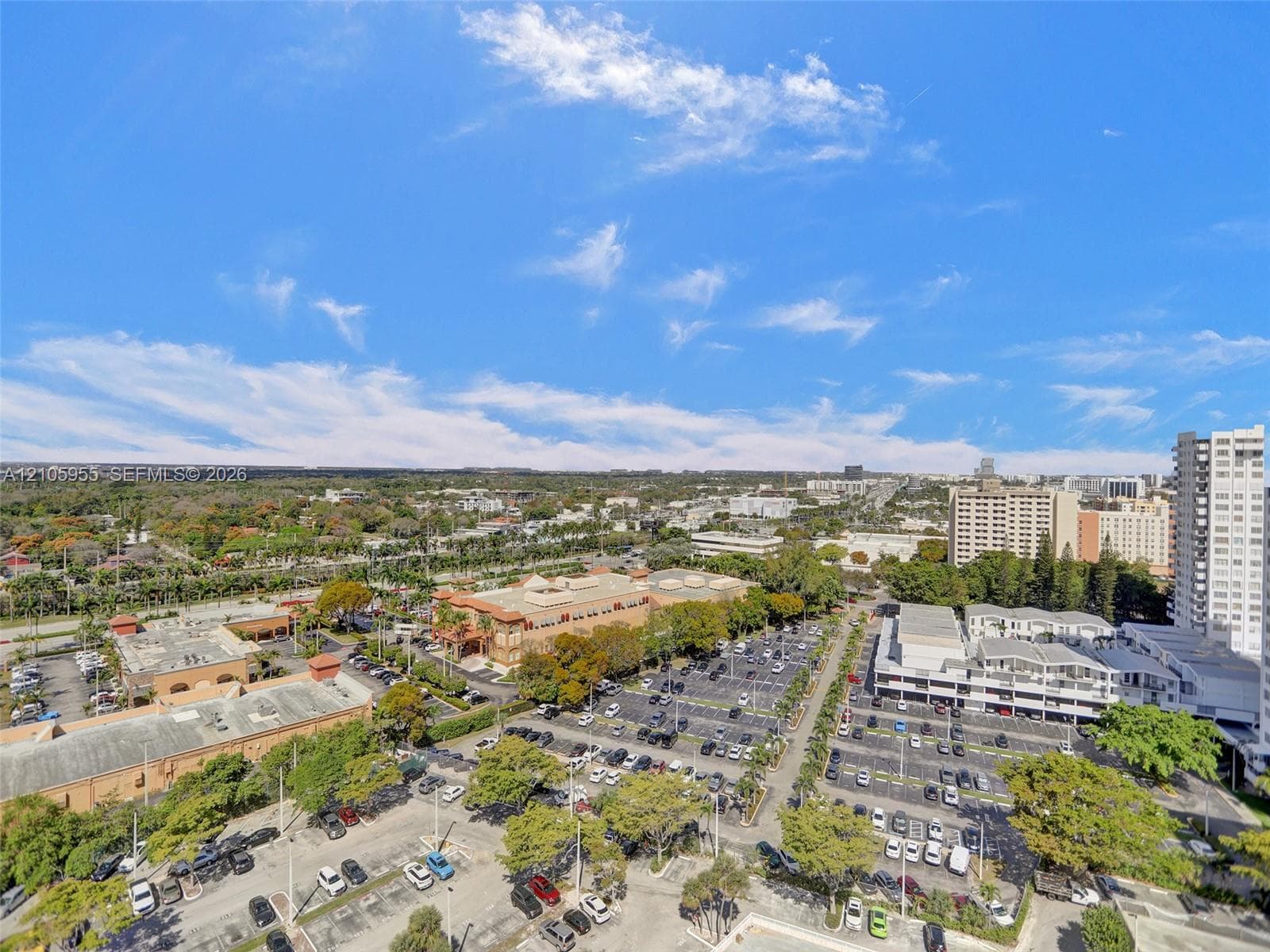 Elevated aerial perspective showcasing the surrounding urban landscape and local topography