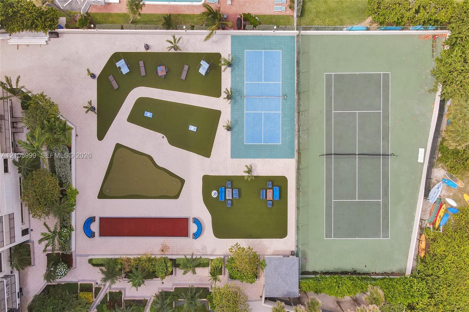 Recreational area featuring a full-size tennis court, pickleball court, bocce ball court, and putting green