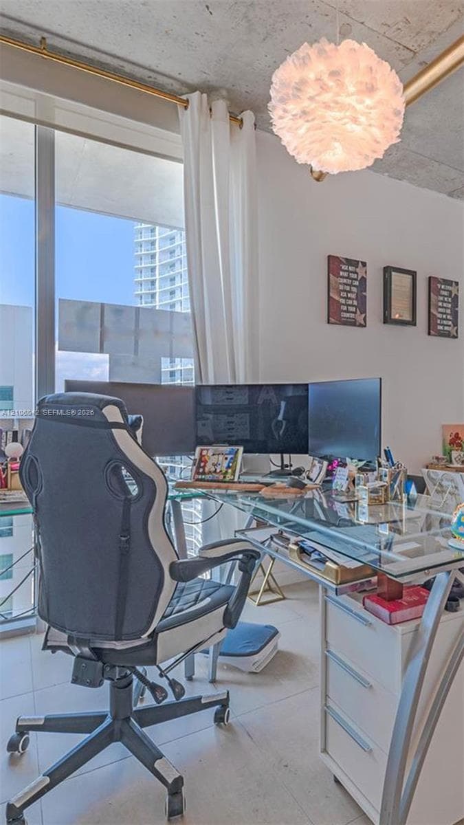 Floor-to-ceiling windows, exposed concrete ceiling, tiled flooring, and modern spherical pendant lighting