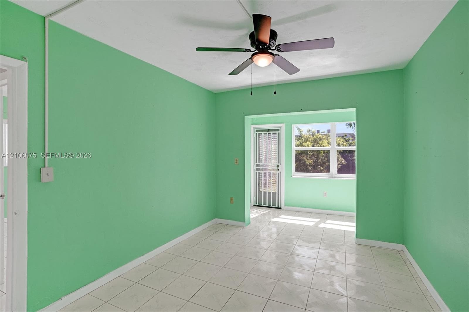Tile flooring, ceiling fan with integrated light fixture, and screen-secured exterior door