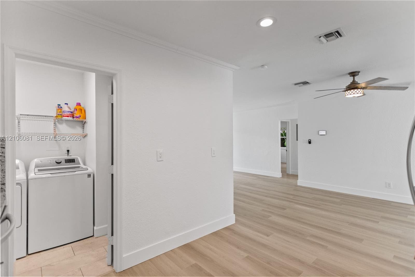 Interior space featuring wood-finish flooring, recessed lighting, and a ceiling fan