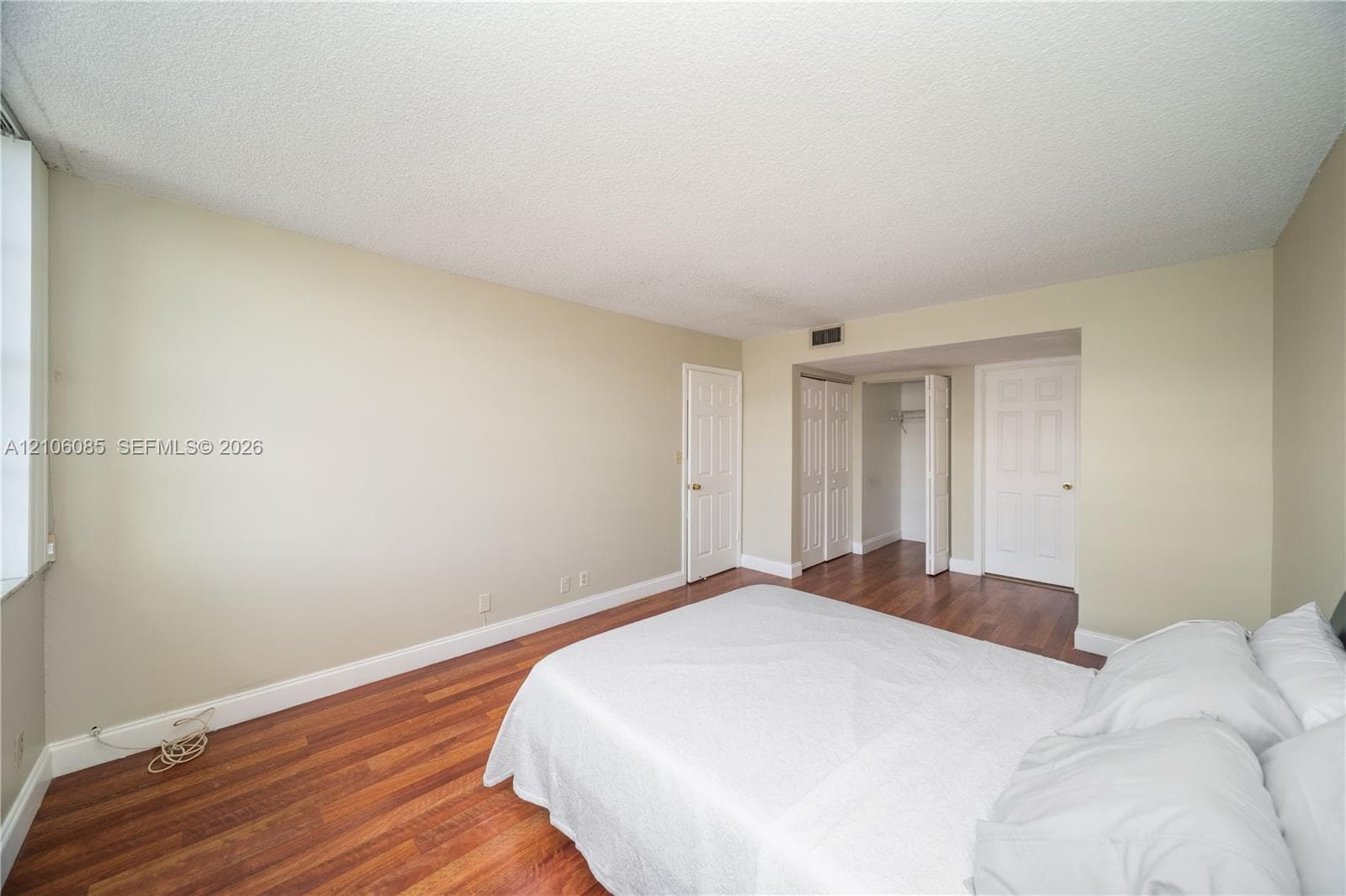 Wood-finish flooring, six-panel interior doors, and built-in closet storage