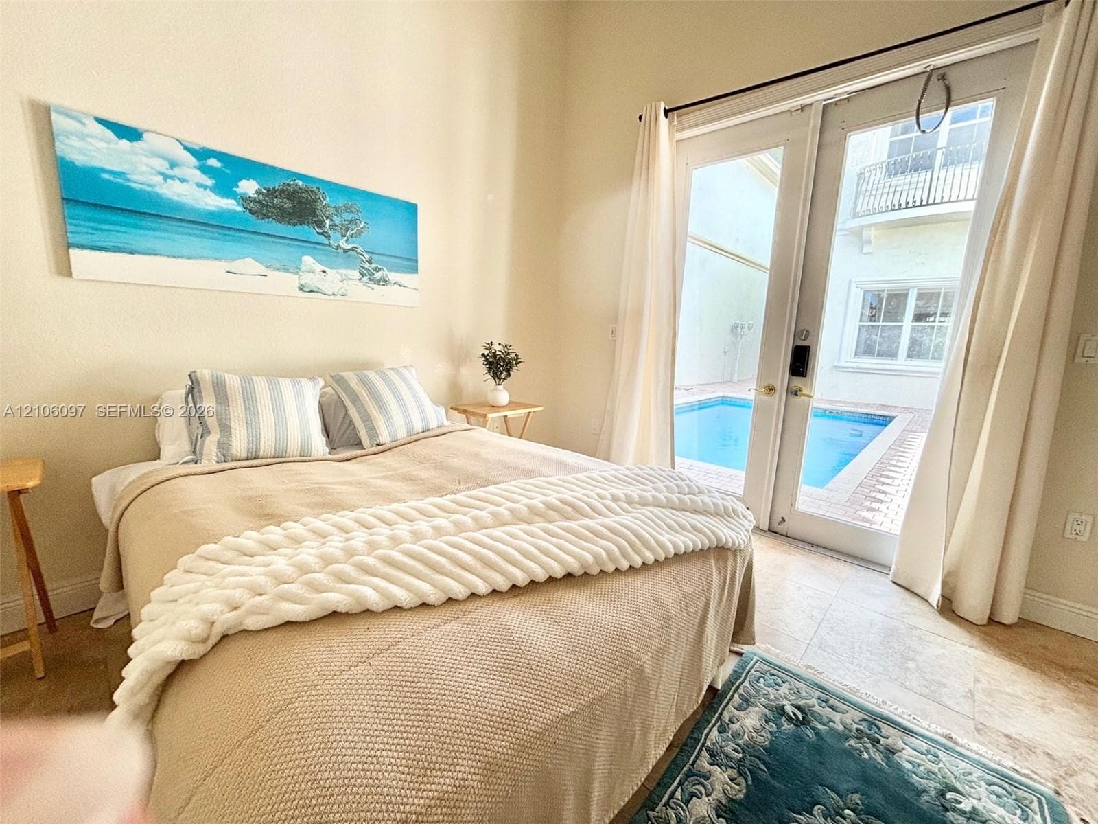 Guest house bedroom overlooking the pool