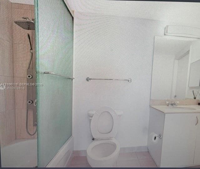 Bathroom featuring a multi-jet shower panel with rainfall showerhead, frosted glass sliding tub enclosure, tiled shower surround, vanity with integrated basin, and large wall-mounted mirror
