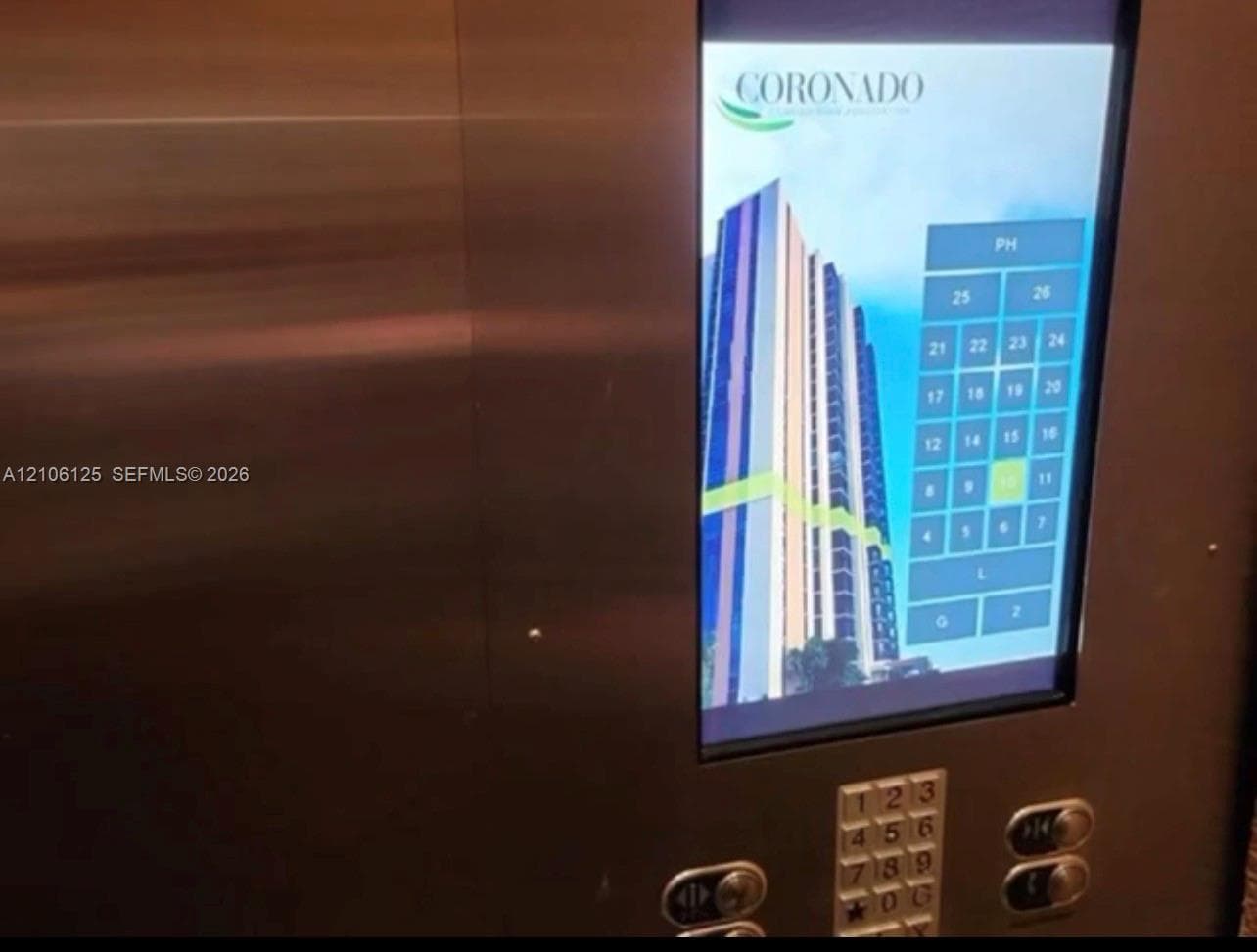 Stainless steel elevator control panel featuring a digital touchscreen interface with integrated building floor selection
