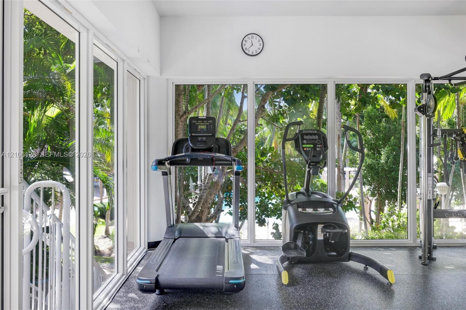 Expansive floor-to-ceiling windows, recessed lighting, and durable flooring