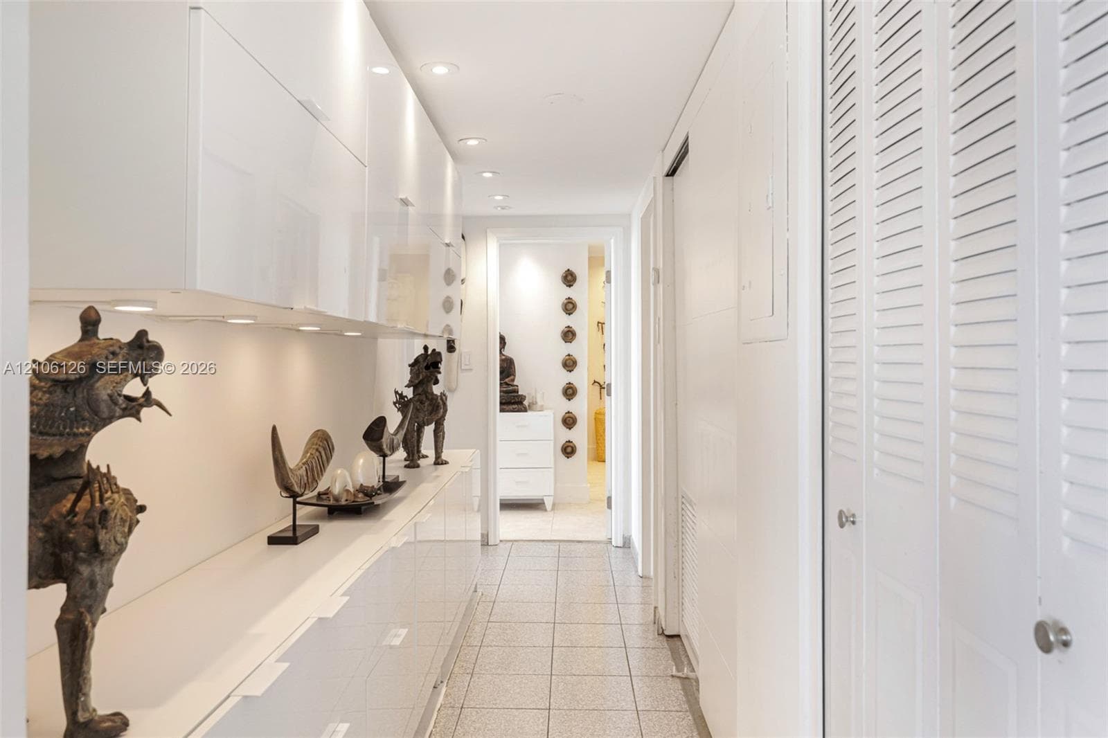 Private balcony featuring metal railings and floor-to-ceiling glass sliding doors