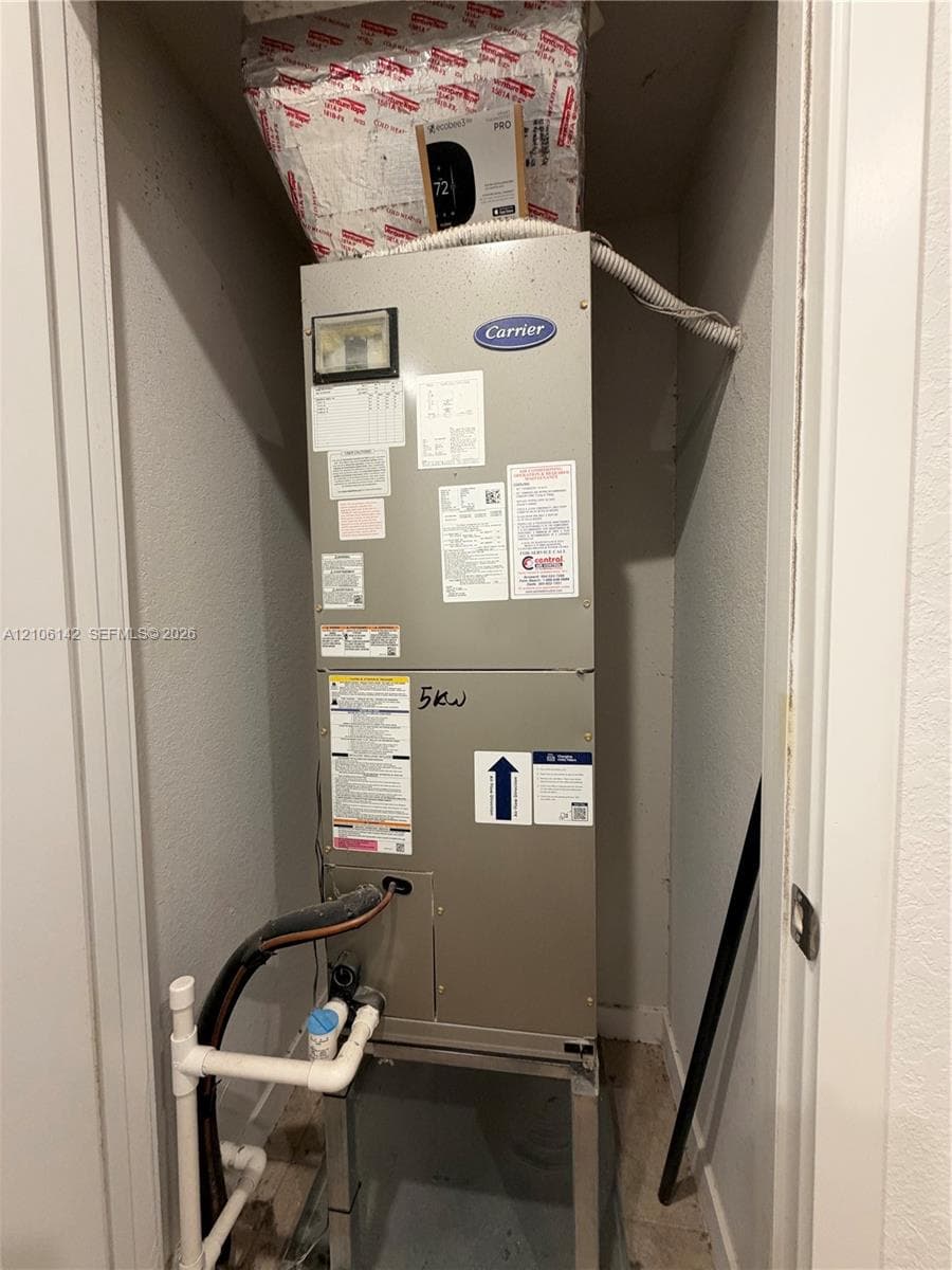 Carrier heating and cooling air handler unit housed within a dedicated utility closet