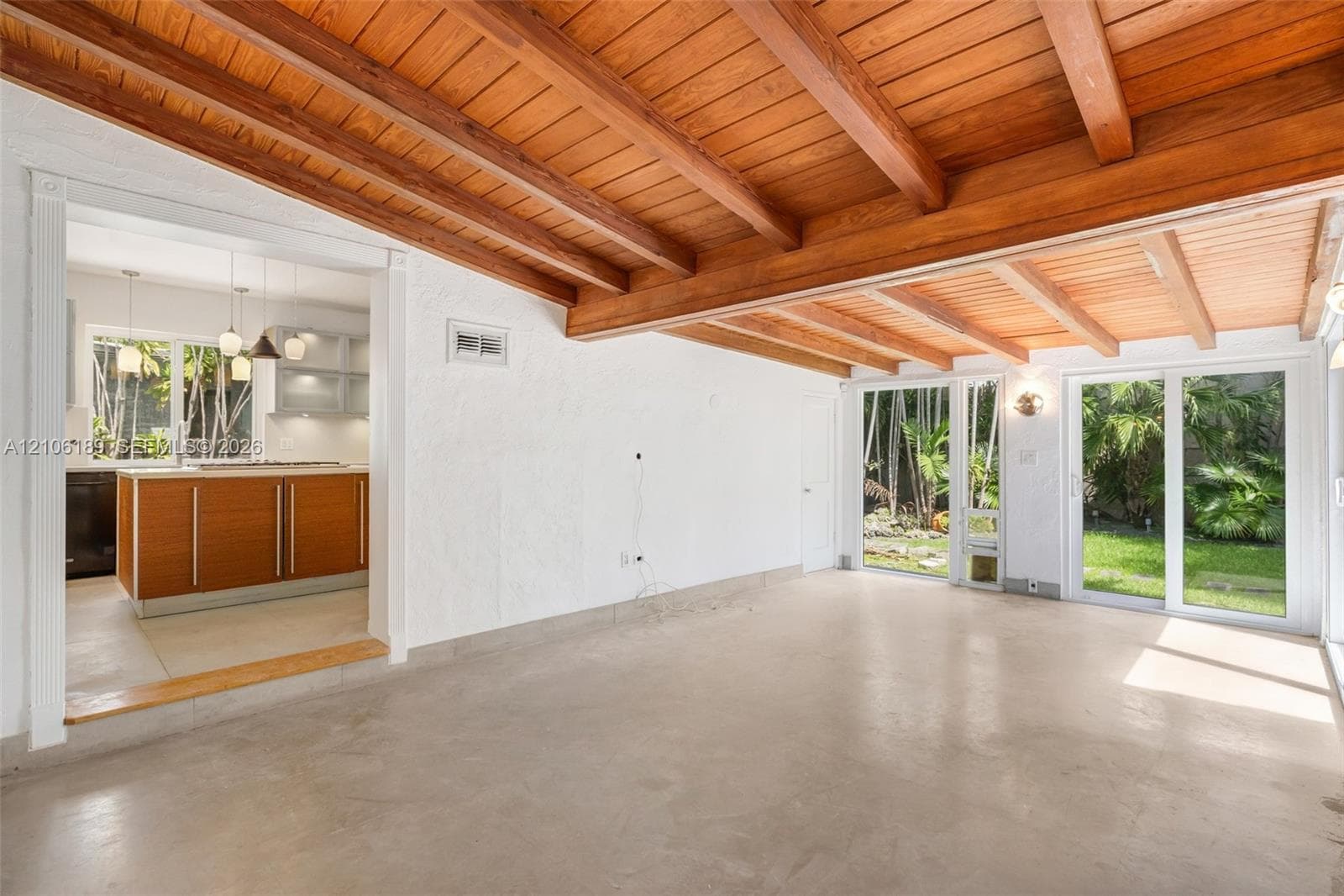 witha view of the kitchen and the garden trough the large sliging windows