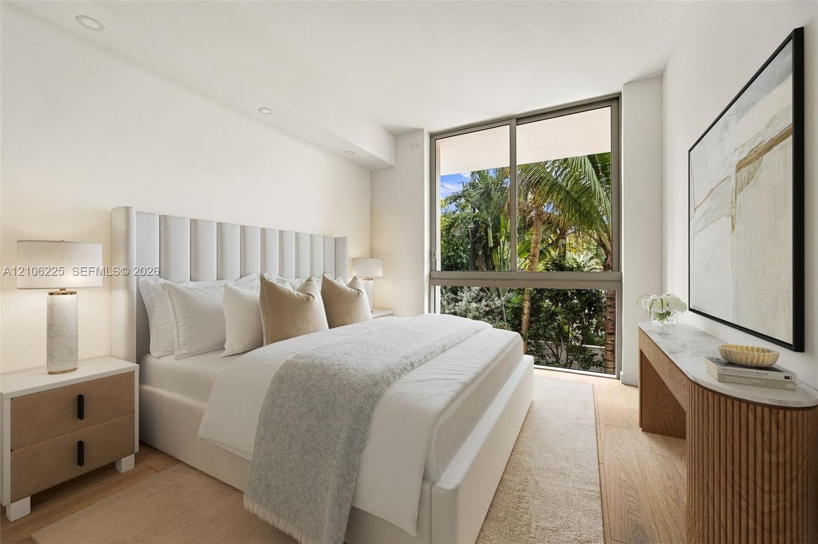 Floor-to-ceiling windows, wood-finish flooring, and recessed ceiling lighting