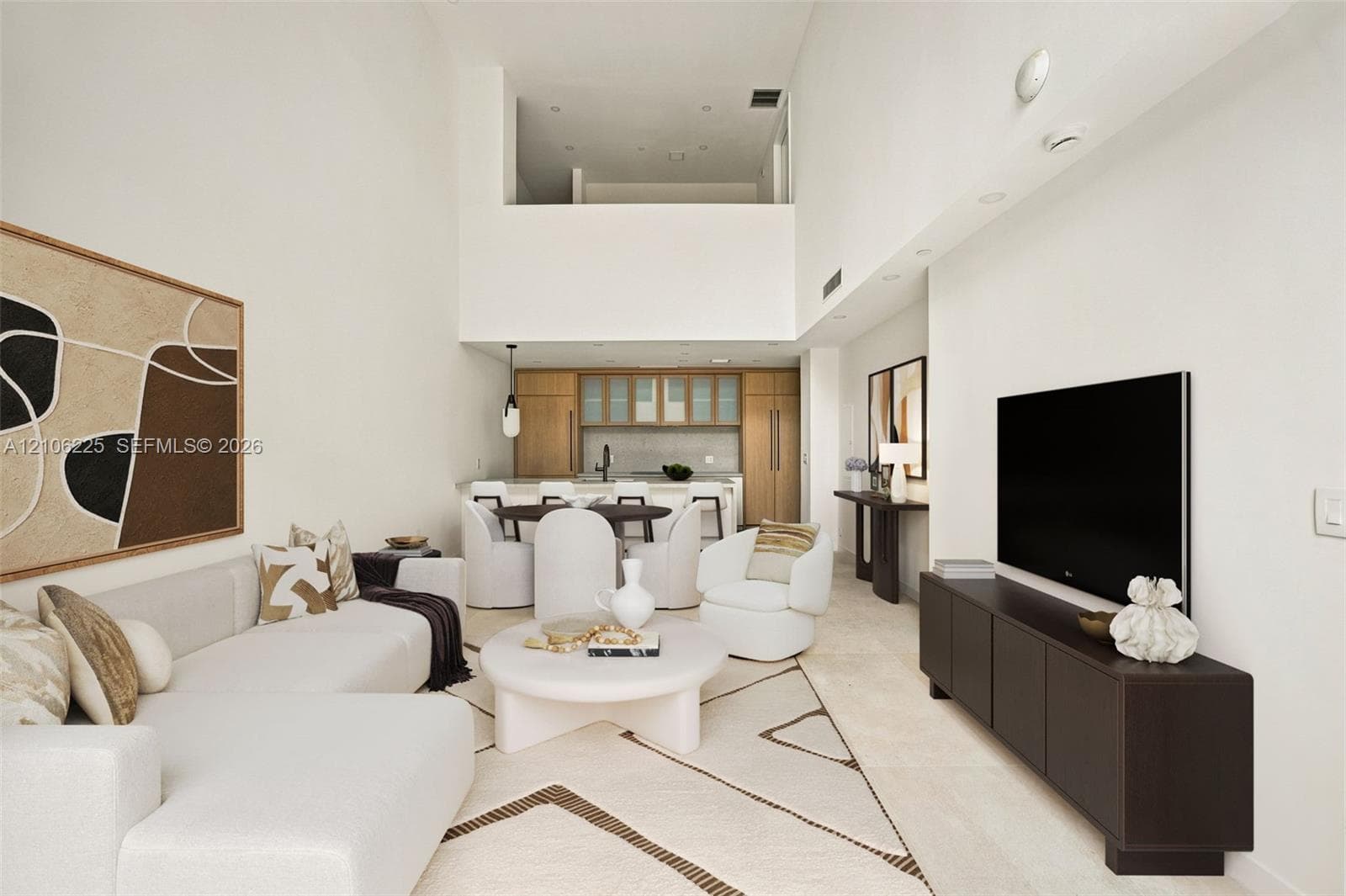 Double-height ceilings, recessed lighting, stone-finish flooring, custom wood-finish cabinetry, and a kitchen island with stone-finish countertops