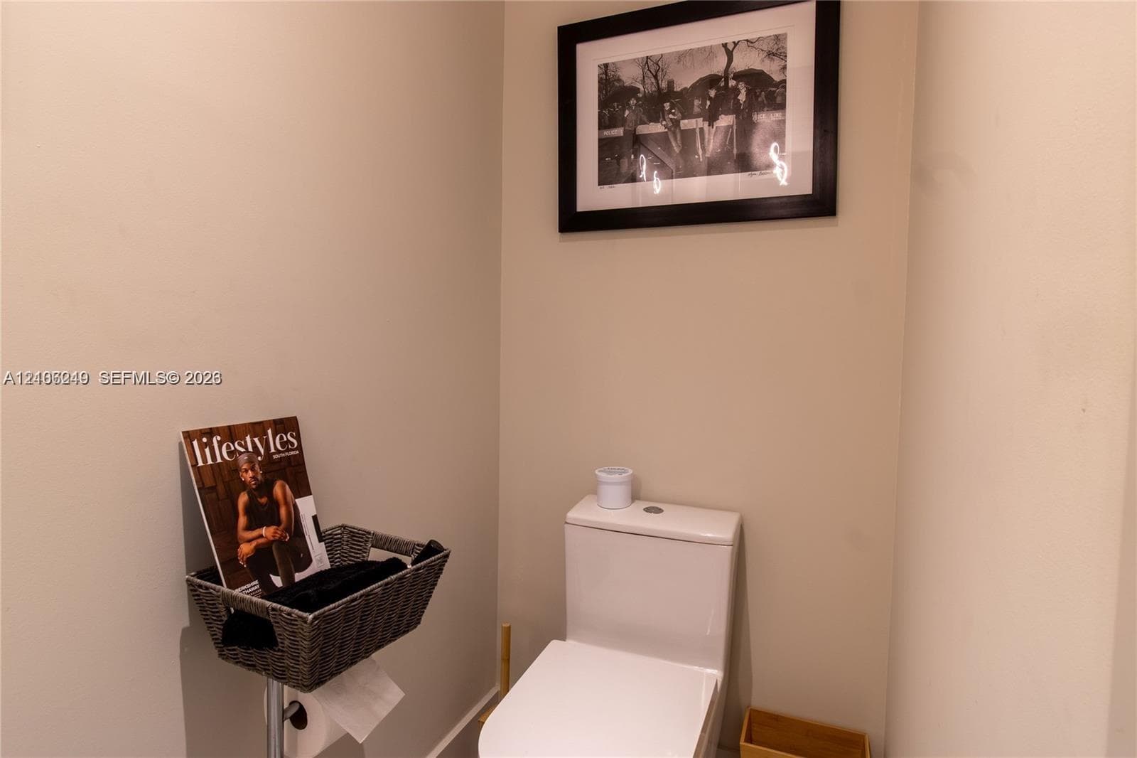 White dual-flush toilet featuring a sleek, minimalist profile