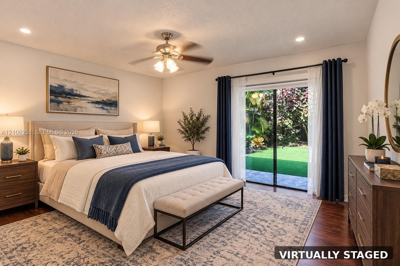 Bedroom featuring wood-finish flooring, recessed lighting, a ceiling fan with integrated light fixture, and sliding glass doors with exterior access