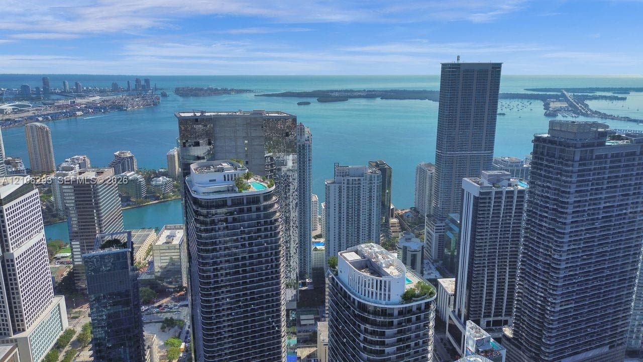 High-rise aerial perspective featuring an expansive urban skyline and prominent waterfront access